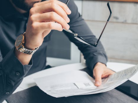 Image of a stressed person reviewing credit card bills