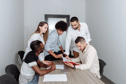 group of diverse young professionals discussing finances